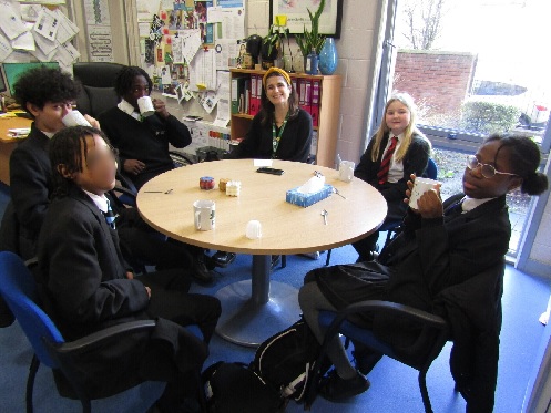 A photo of students who have achieved a Hot Chocolate with their headteacher  for excellence