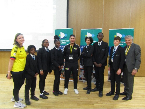 Ms Calver, Steve Eadon, David Dein and students in the Pheonix Hall