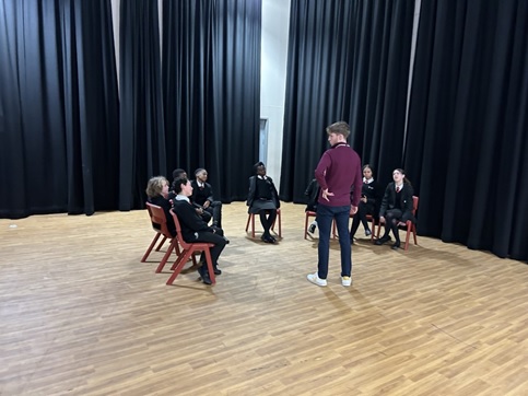 A group of y7 students being menored for Debate Mate