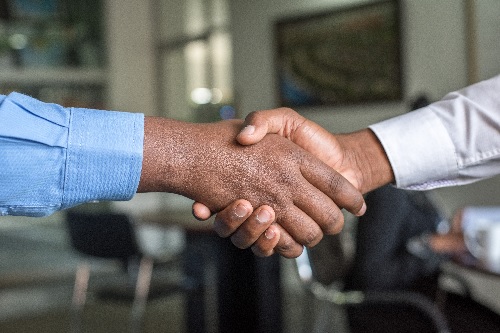 Image of men shaking hands