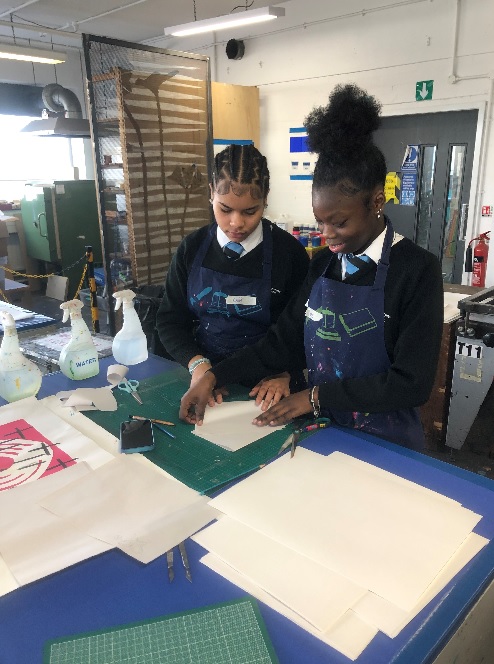 Students learning to screen print