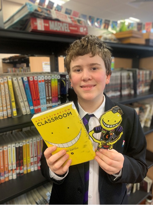 Y8 Student with a book and a self-made bookmark