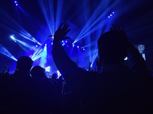 Photo of a crowd listening to a rock band