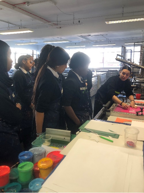 Students learning to screen print